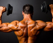 Das Athlete With Dumbbells In Gym Wallpaper 176x144