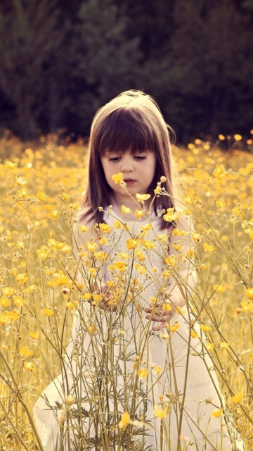 Cute Little Girl In Flower Field wallpaper 360x640