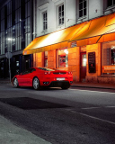 Screenshot №1 pro téma Red Ferrari In City Lights 128x160