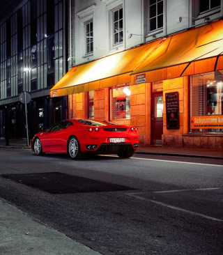Red Ferrari In City Lights - Obrázkek zdarma pro 480x640