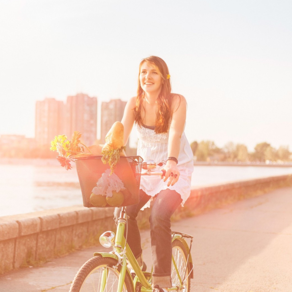 Girl On Bicycle In Sun Lights wallpaper 1024x1024