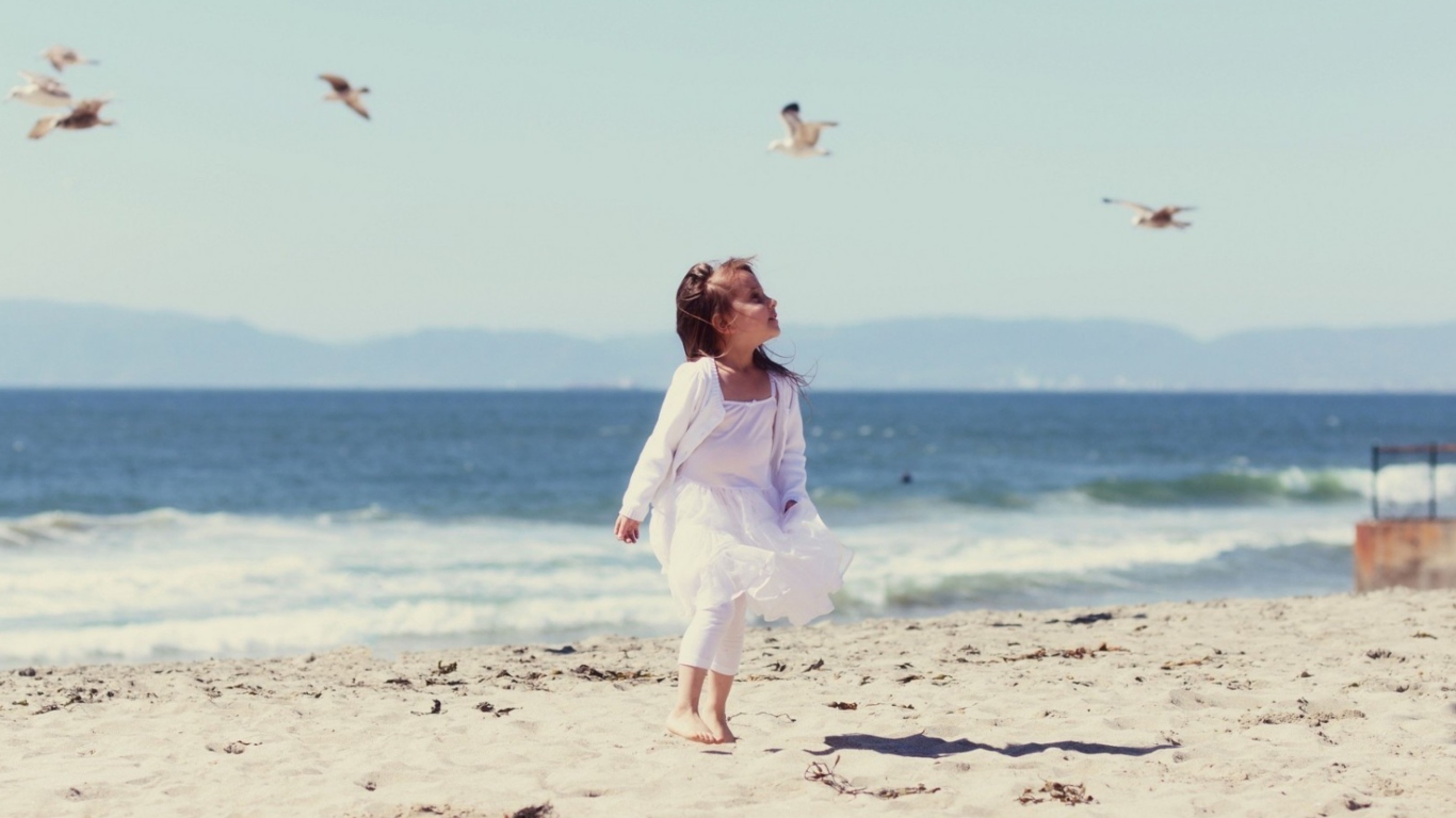 Little Girl And Seagulls On Beach screenshot #1 1366x768