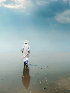 Man In White Hat Walking On Water wallpaper 240x320