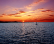 Ship In Sea At Sunset wallpaper 176x144