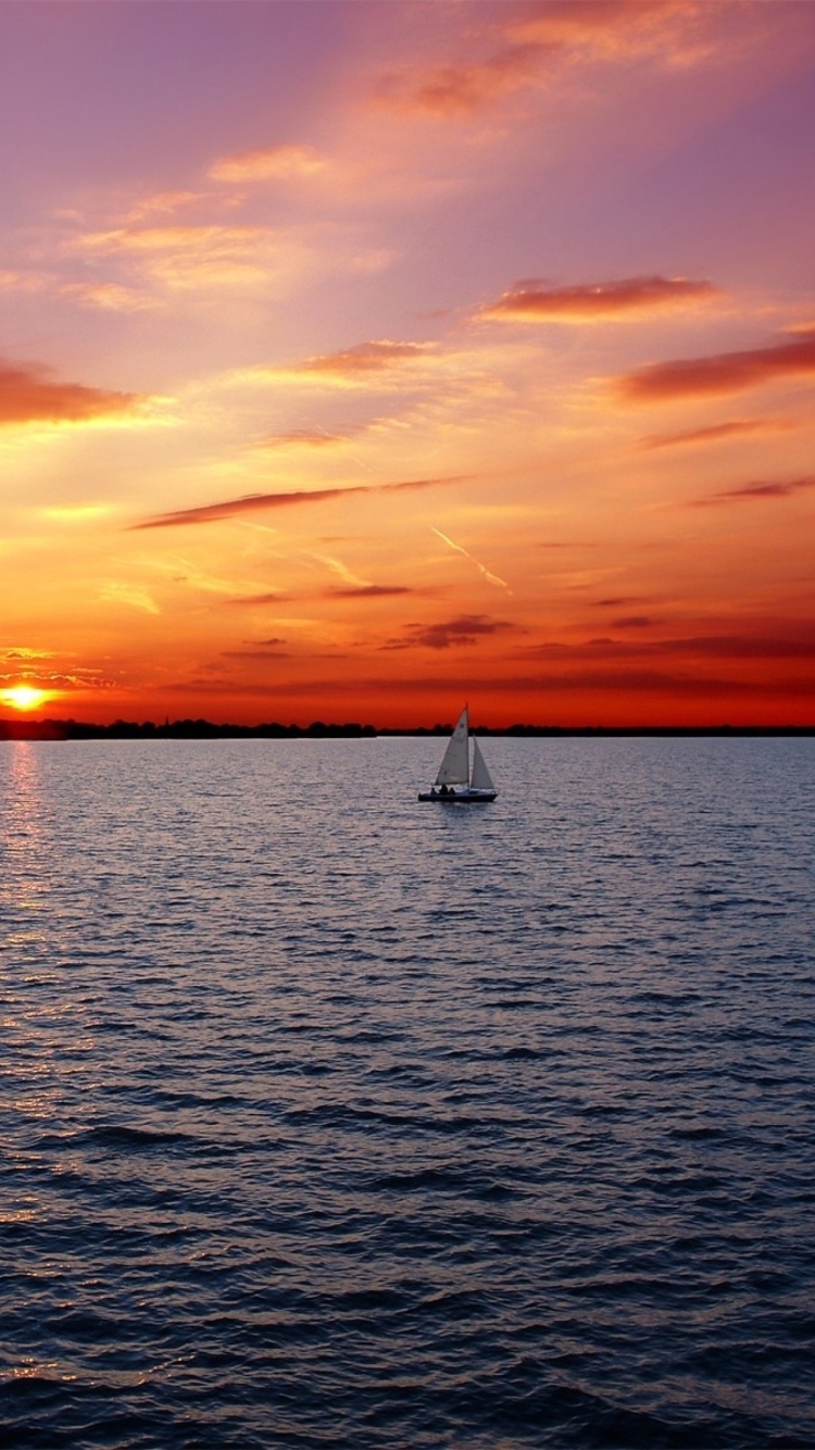 Ship In Sea At Sunset wallpaper 750x1334