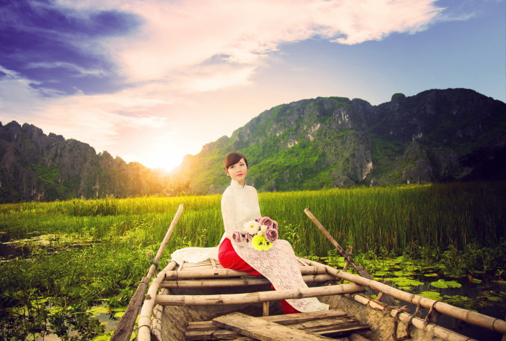Beautiful Asian Girl With Flowers Bouquet Sitting In Boat wallpaper