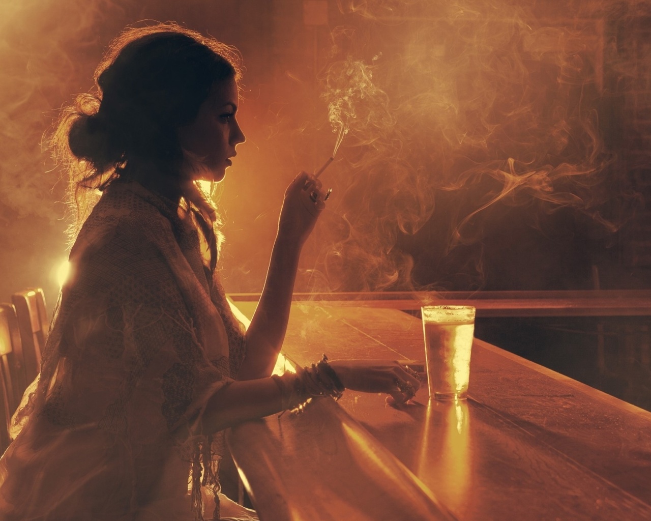 Sad girl with cigarette in bar wallpaper 1280x1024