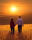 Couple at sunset wallpaper 128x160
