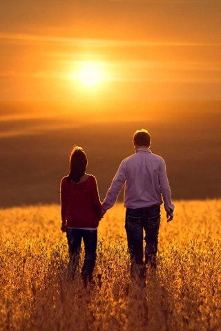 Couple at sunset wallpaper 320x480