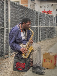 Jazz saxophonist Street Musician wallpaper 240x320