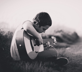 Kostenloses Boy With Guitar Wallpaper für iPad