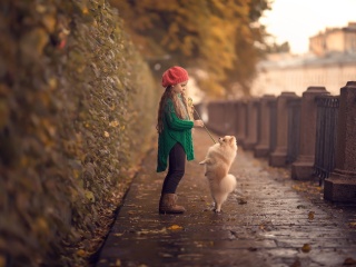 Child and dog spitz wallpaper 320x240