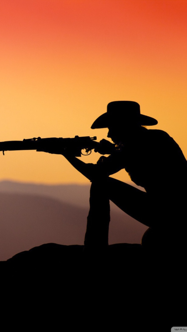 Cowboy Shooting In The Sunset wallpaper 640x1136