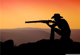 Cowboy Shooting In The Sunset Background for Android, iPhone and iPad
