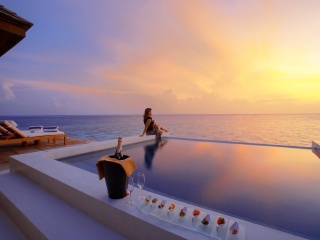 Maldives pool with girl wallpaper 320x240