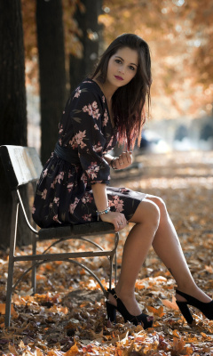 Обои Caucasian joy girl in autumn park 240x400