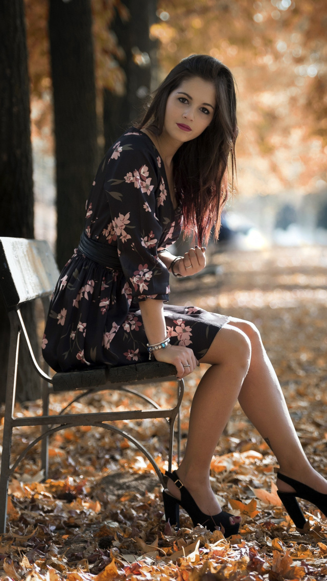 Caucasian joy girl in autumn park wallpaper 640x1136