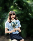 Cute Asian Model With Flower Bouquet wallpaper 128x160