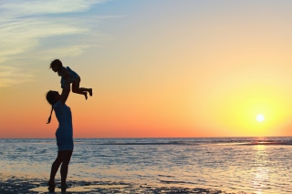 Mother And Child On Beach Background for Android, iPhone and iPad