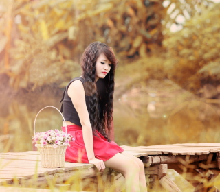 Kostenloses Sad Asian Girl With Flower Basket Wallpaper für 208x208