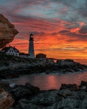 Обои Sunset and lighthouse 128x160