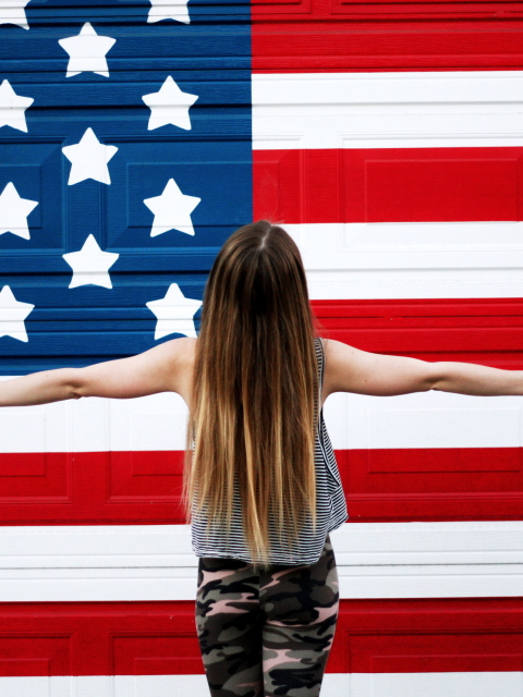 American Girl In Front Of USA Flag wallpaper 480x640