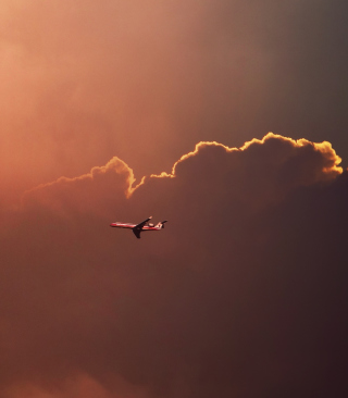 Kostenloses Airplane In Red Sky Above Clouds Wallpaper für 480x640