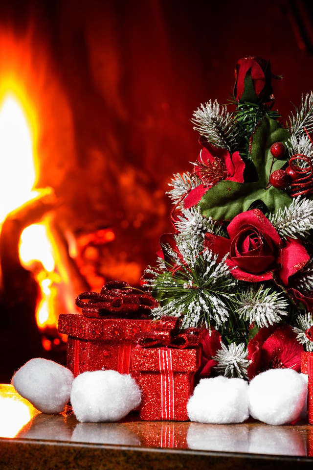 Christmas near Fireplace wallpaper 640x960