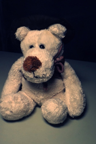 Sfondi Sad Teddy Bear Sitting Alone 320x480