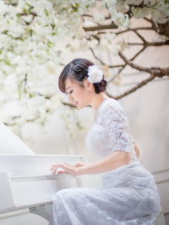 Cute Asian Girl In White Dress Playing Piano wallpaper 240x320