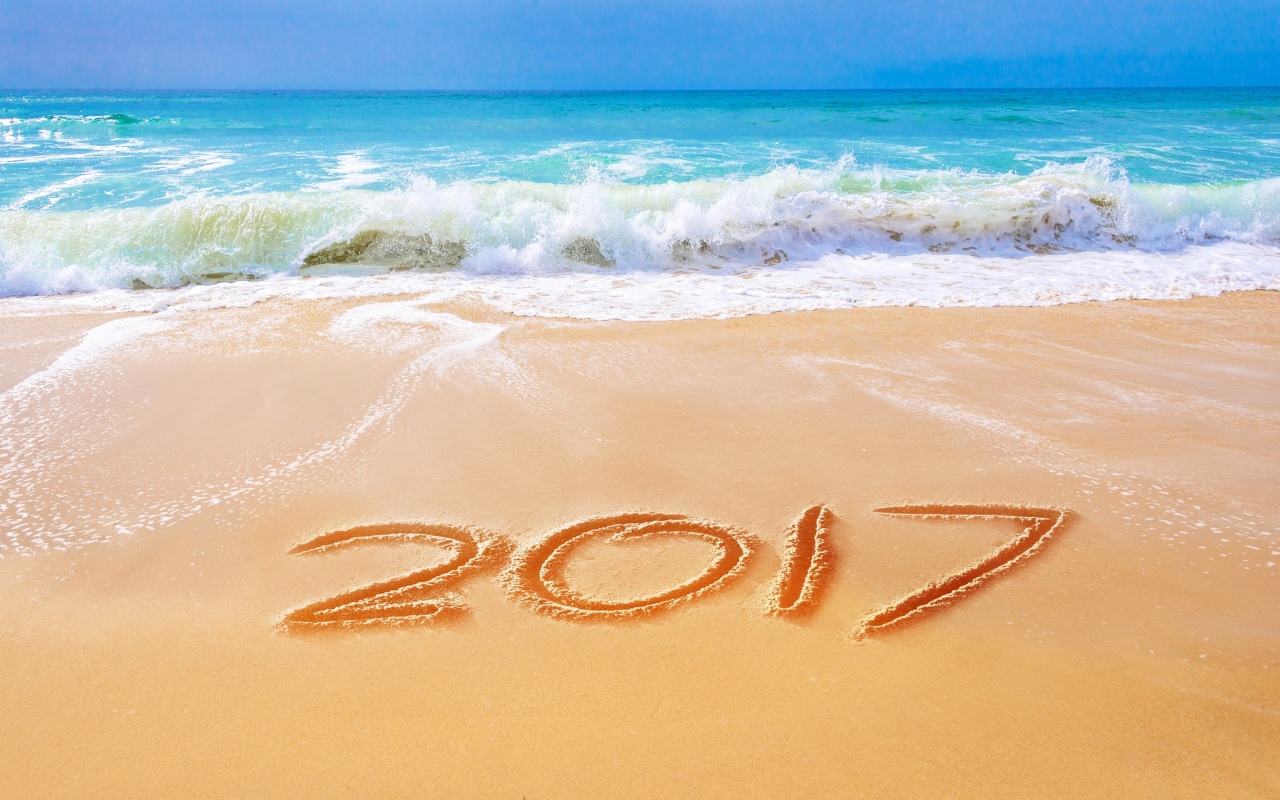 Обои Happy New Year 2017 Phrase on Beach 1280x800