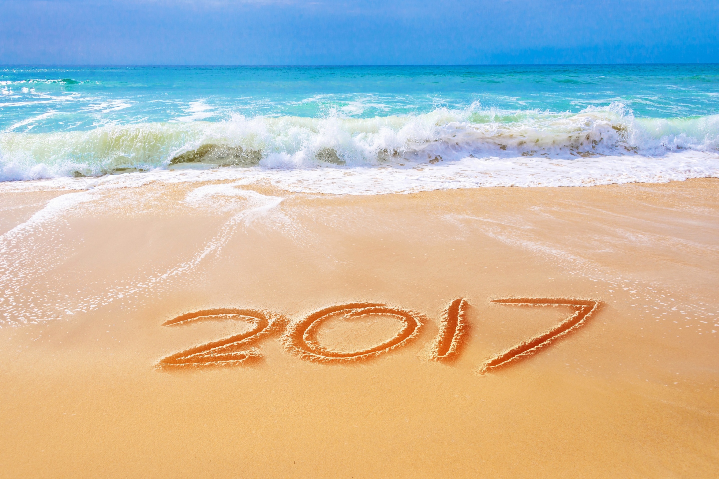 Обои Happy New Year 2017 Phrase on Beach 2880x1920