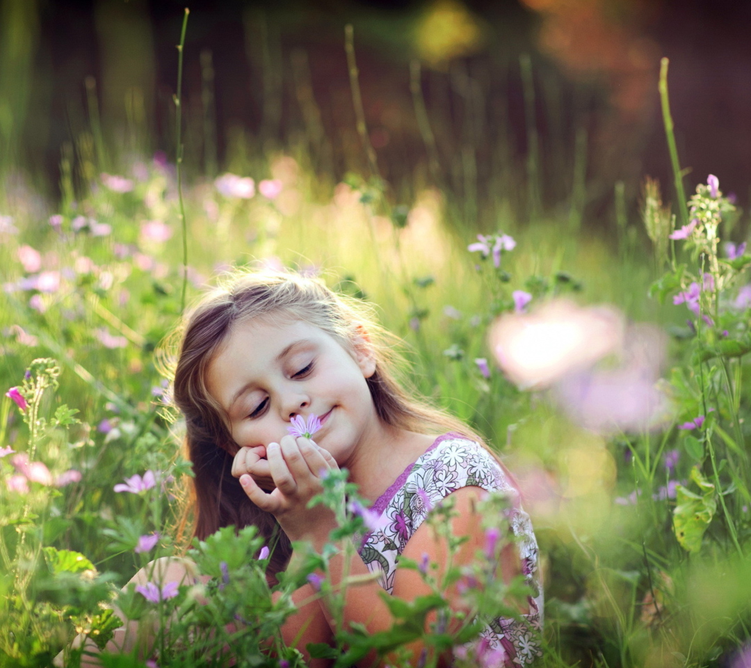 Обои Little Girl Enjoying Nature 1080x960