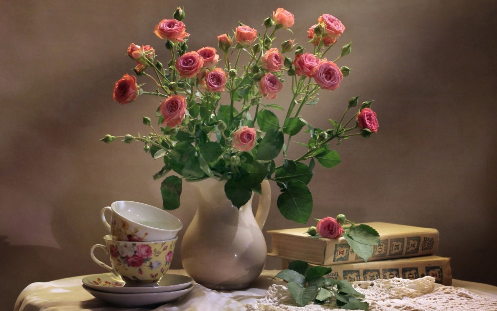 Still life of vintage books and roses wallpaper 1680x1050