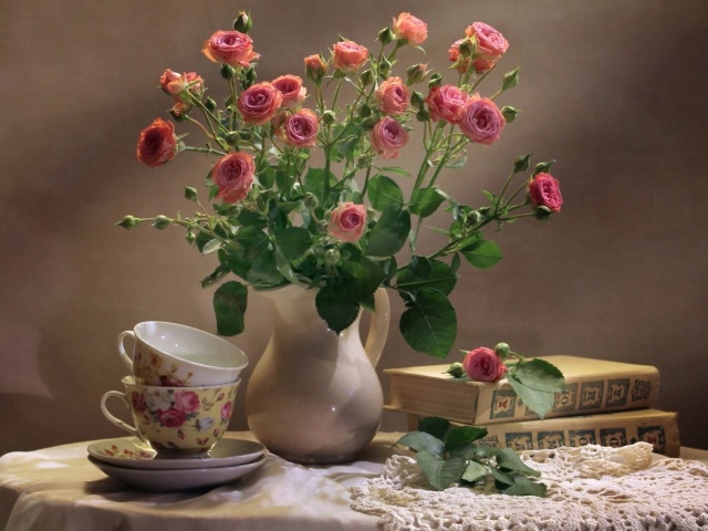 Still life of vintage books and roses wallpaper 640x480