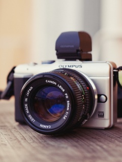 Обои Olympus DSLR Camera 240x320