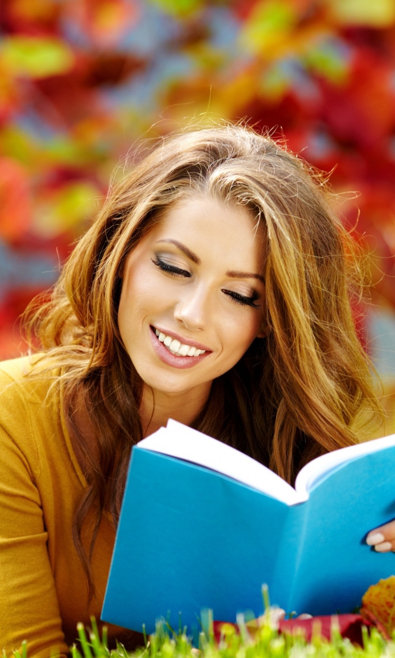 Обои Girl Reading Book in Autumn Park 768x1280