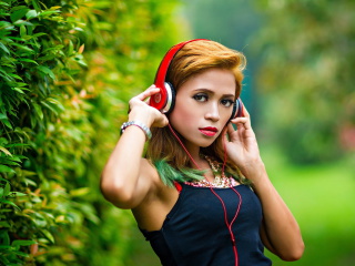 Sweet girl in headphones wallpaper 320x240