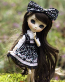 Screenshot №1 pro téma Cute Doll With Dark Hair And Black Bow 128x160