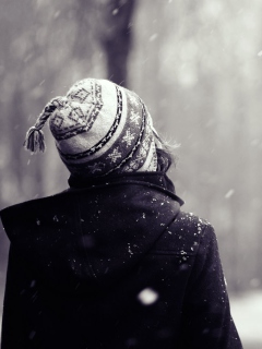 Girl Looking At Falling Snow wallpaper 240x320