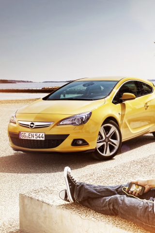 Couple with Opel wallpaper 320x480