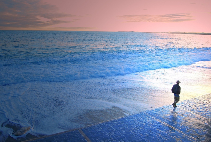 Man Walking By Beach wallpaper