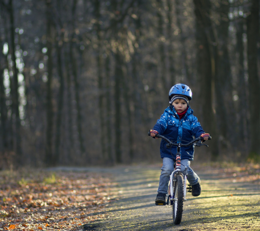 Обои Little Boy Riding Bicycle 1080x960