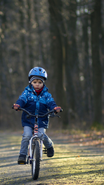 Little Boy Riding Bicycle wallpaper 360x640