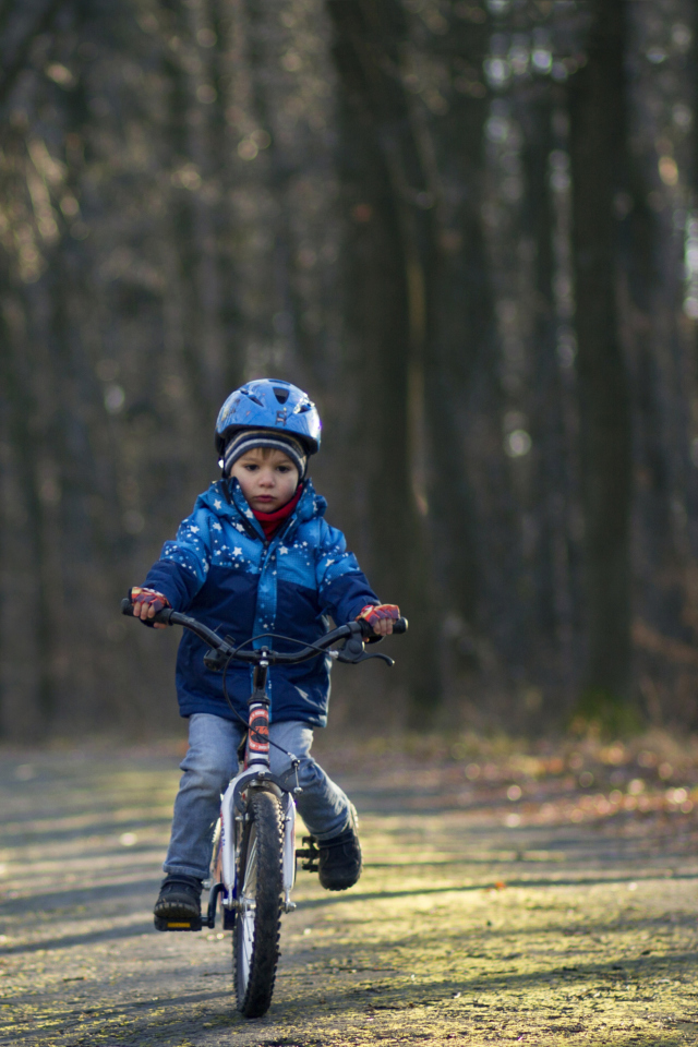 Обои Little Boy Riding Bicycle 640x960