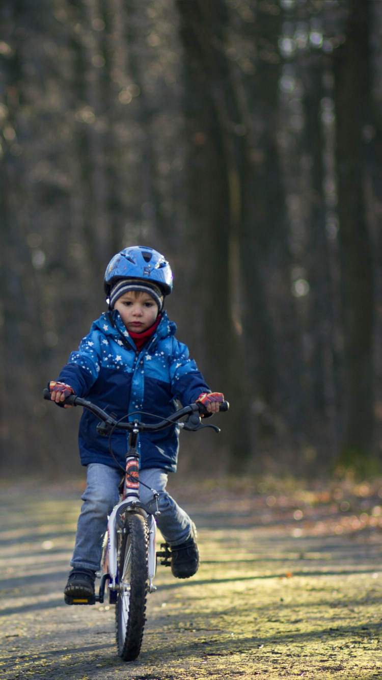 Little Boy Riding Bicycle wallpaper 750x1334