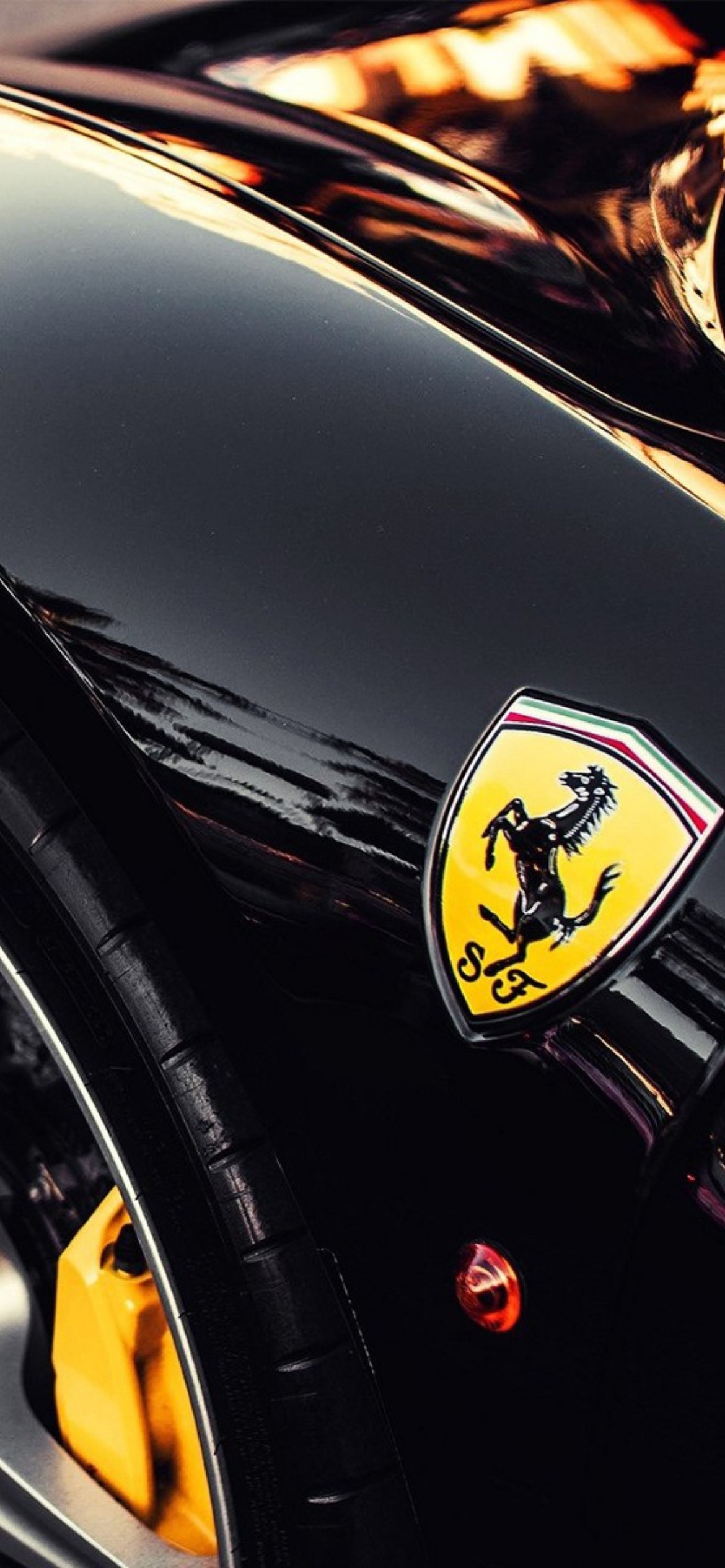 Das Black Ferrari With Yellow Emblem Wallpaper 1170x2532