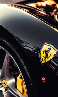Black Ferrari With Yellow Emblem wallpaper 240x400