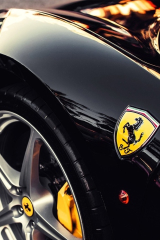 Black Ferrari With Yellow Emblem wallpaper 320x480