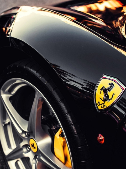 Fondo de pantalla Black Ferrari With Yellow Emblem 480x640